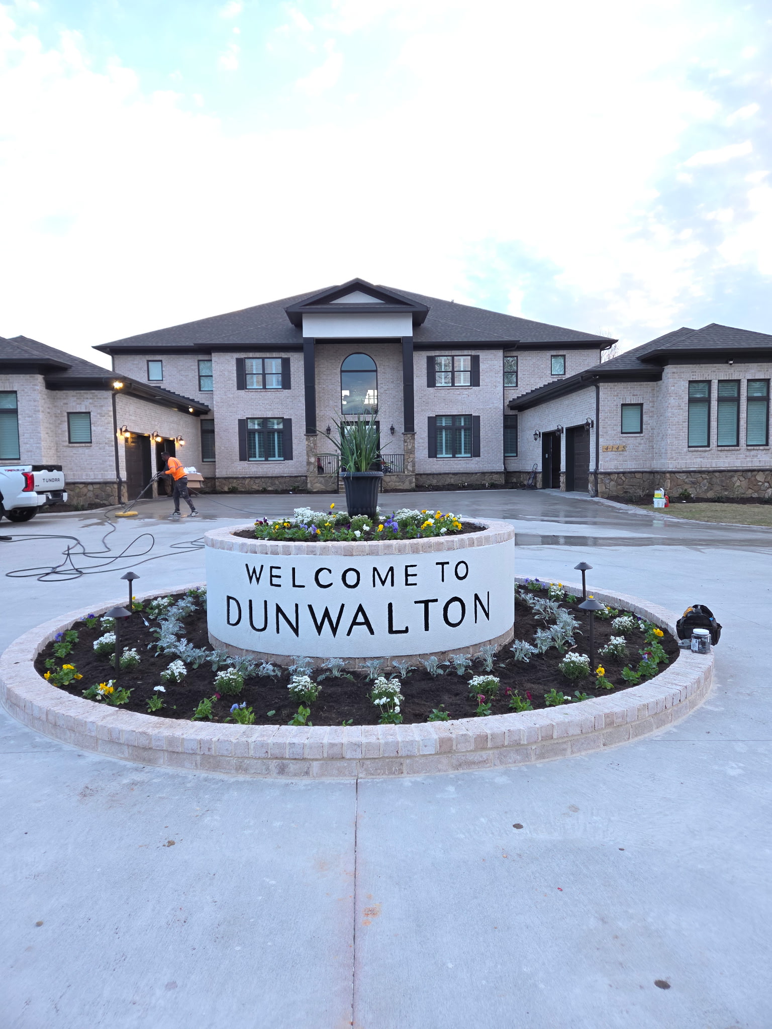 Dun Walton house with professional landscaping and maintained lawn